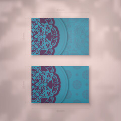 Presentable business card in turquoise color with purple mandala pattern for your personality.