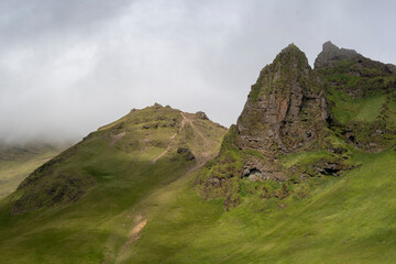 Cloudy landscape of grassy cliffs in Vik South Iceland