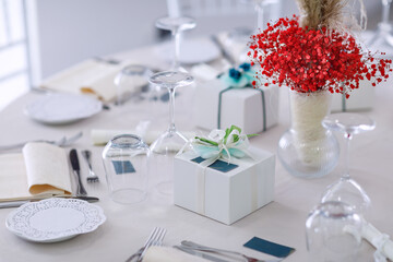 wedding bomboniere at a banquet, boxes with ribbons