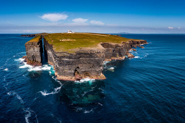 Proud, beautiful, graceful, ever-watching over our beautiful part of the world. Loop Head Lighthouse is situated on the scenic Loop Head peninsula in County Clare, Ireland  - obrazy, fototapety, plakaty