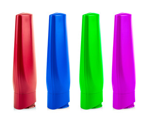 Colored Plastic Bottles with Shampoo or hygienic cosmetic product isolated on white background
