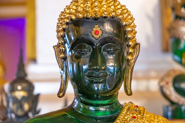 Green Buddha statue at Wat Saket, also known as the Temple of the Golden Mount, in Bangkok