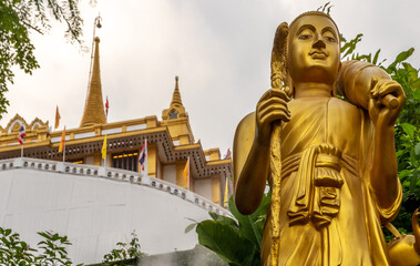 Golden statue at Wat Saket in Bangkok Thailand, which is also known as Phy Khao Thong