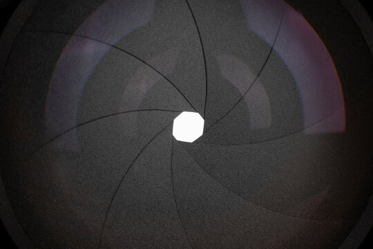 Photography of Circular Aperture Diaphragm. Macro of an black iris, Front close-up, background.