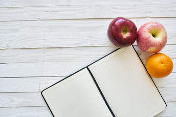 diet notebook fruit healthy food breakfast light background