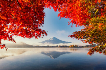 Fuji Mountain and Red Maple Leaves with Morning Mist at Kawaguchiko Lake in Autumn, Japan