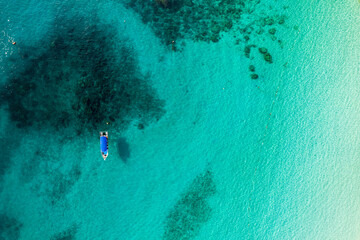 aerial view of boat not far from island beach