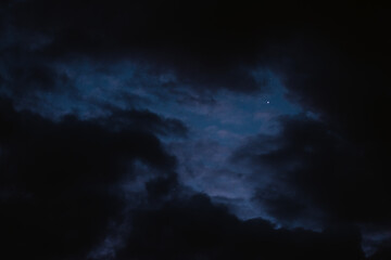 Stars in the night sky bring the clouds together