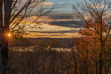 Palmerston Lake Sunset over the tree line in Autumn