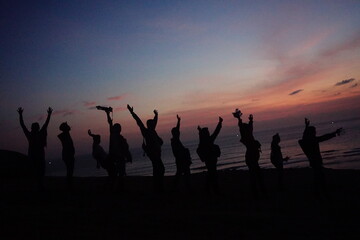 Fototapeta na wymiar silhouettes of people on sunset