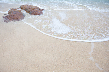 Soft wave of the sea on the sandy beach
