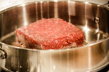 Ground beef in a pan cooking 