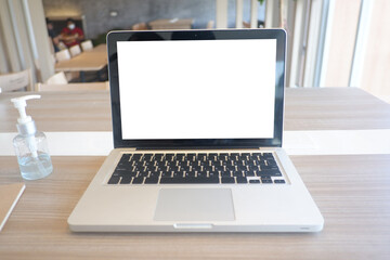 Fototapeta premium Cropped shot view of the labtop with blank copy space screen for your information content or text message on the gray granite at the modern place