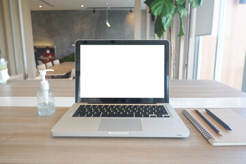 Fototapeta premium Cropped shot view of the labtop with blank copy space screen for your information content or text message on the gray granite at the modern place