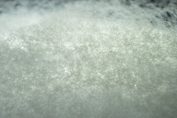 close up image of froth on white background. The images shows the links between bubbles. Image suitable to be used as background or textures.
