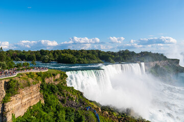 Fototapeta premium Witnessing the awe-inspiring beauty of Niagara Falls, where the powerful cascade of water creates a natural wonder that captivates the heart and soul.