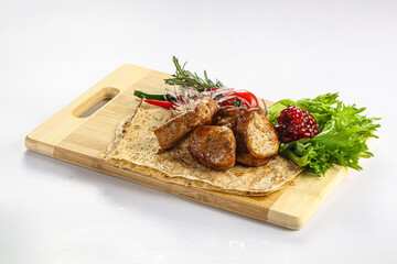 Pork tenderlion kebab over board