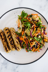 vegan sausages with fresh side salad, healthy plant-based food