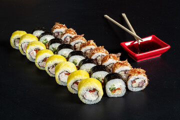 tasty sushi on the black background