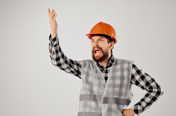male worker orange helmet blueprints Professional light background