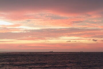 horizon from the seashore during golden hour in the evening