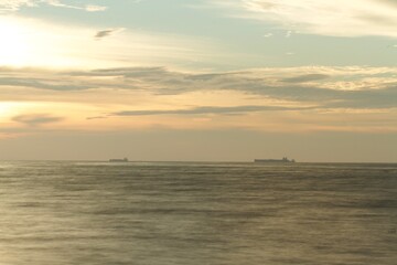 horizon from the seashore during golden hour in the evening