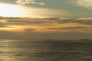 horizon from the seashore during golden hour in the evening