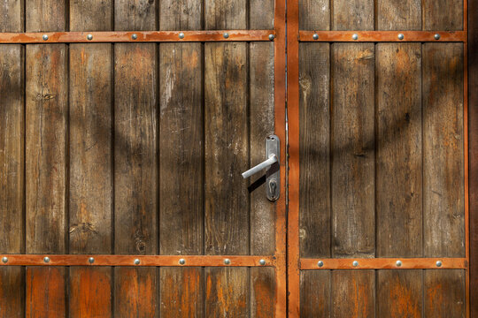 Beautiful old wooden gate. Construction and repair. Front view. Close-up.