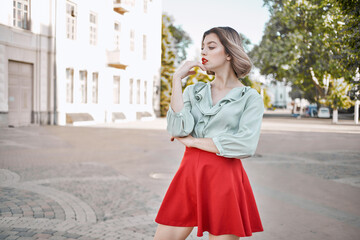 Fototapeta premium pretty woman attractive look red lips walk in the park lifestyle