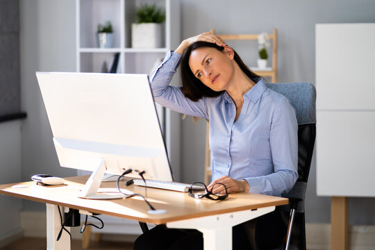 Woman Stretches At Office Desk. Stretch Exercise