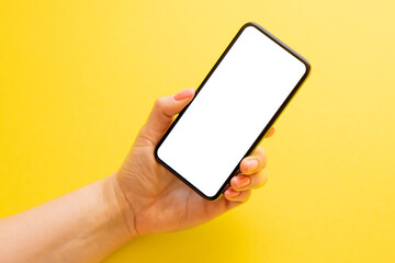 Mobile phone with empty white screen on yellow background