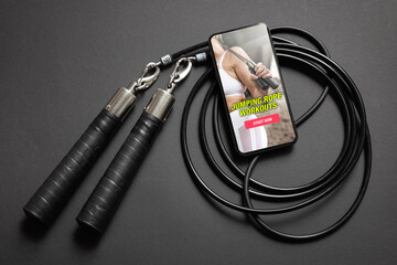 Jumping rope and mobile phone with exercise app © Kaspars Grinvalds