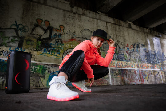 Young hip hop girl wearing LED sneakers