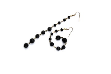 Women`s jewelry long earrings on a white background.