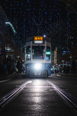 Fototapeta na wymiar Tram in Zurich under Christmas lights