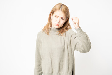 怒っているセーターを着た若い女性 - obrazy, fototapety, plakaty