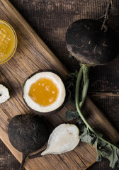 Organic raw Black radish with honey on wooden table. Homemade cough medicine. Folk remedy for immunity.