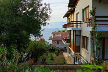 View of green spaces, trees and flowering shrubs in the Princes' Islands city of Istanbul. Public...