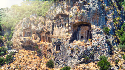 Kings Tombs in the cliff face Kaunos Dalyan,Turkey. Ruins of the ancient town Tlos. View of ancient Lycian rock tombs date back to 4th Century B.C.