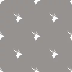 Fototapeten seamless winter pattern with silhouette of deer head with antlers. © Ne Mariya