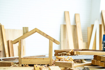 DIY project at home concept, House made of wood with craft tools on workbench.Table for making handmade wood work at carpenter's home.