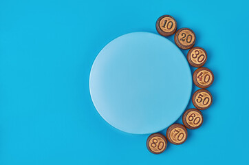 wooden numbers and a round blue podium on a blue background