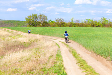 Motorcycles on the country road . Off road moto riding . Traveling by motorcycle