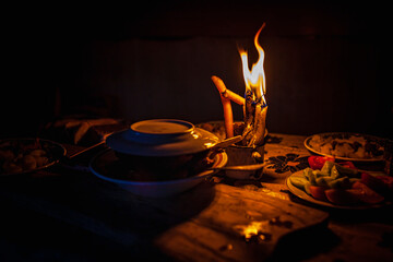 Dinner by candlelight during power outage in deep provinces, without electricity. Power crisis in...