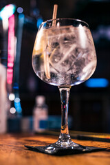 Craft Gin Delight: A Sparkling Glass on a Rustic Pub Bar