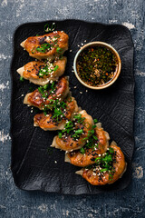Traditional japaneese gyoza with meat, dumplings snack. Fried dumplings Gyoza in plate