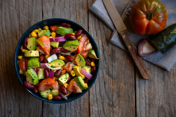 Avocado salad with other vegetables, tomatoes and corn. Healthy food