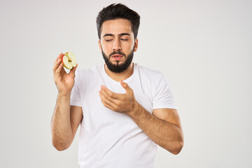 emotional bearded man with apple in his hands fruit snack