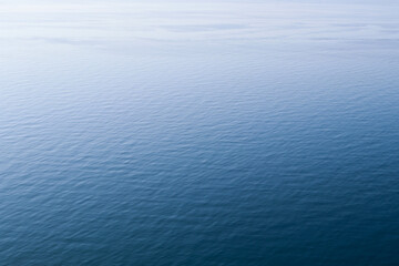 Calm clear blue sea water background. Blue azure sea water texture.