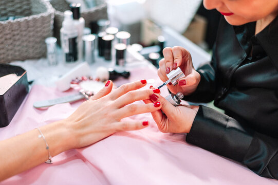 Unrecognizable woman getting her nails done at the beauty salon